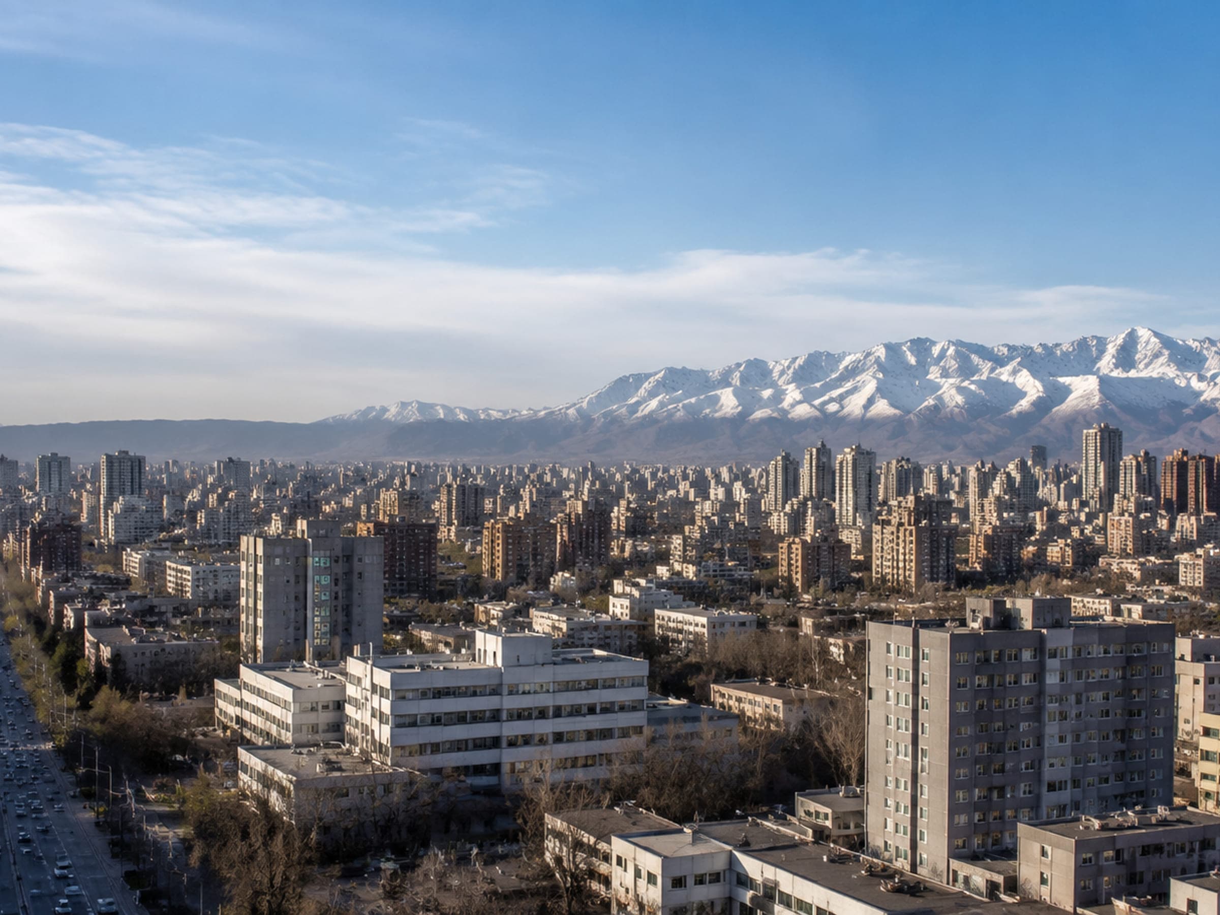 Urumqi city with the snow-covered Tianshan mountains beyond