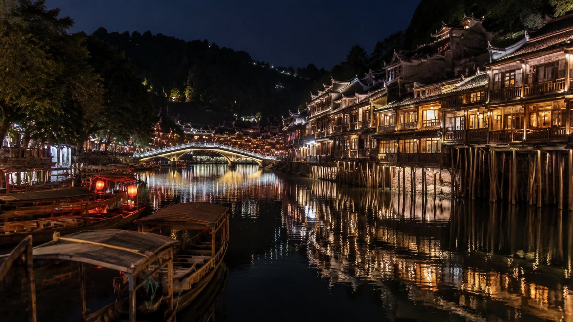 Fenghuang Ancient Town night lights reflected on the Tuojiang River