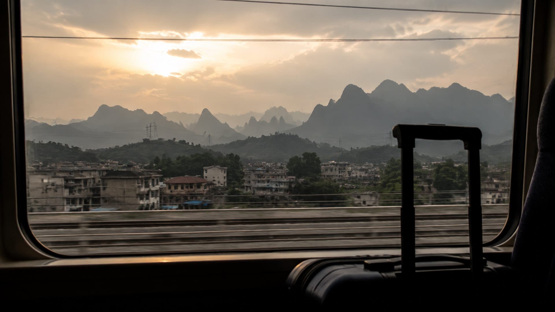 Train-window view of Hunan hills for a Zhangjiajie and Fenghuang route
