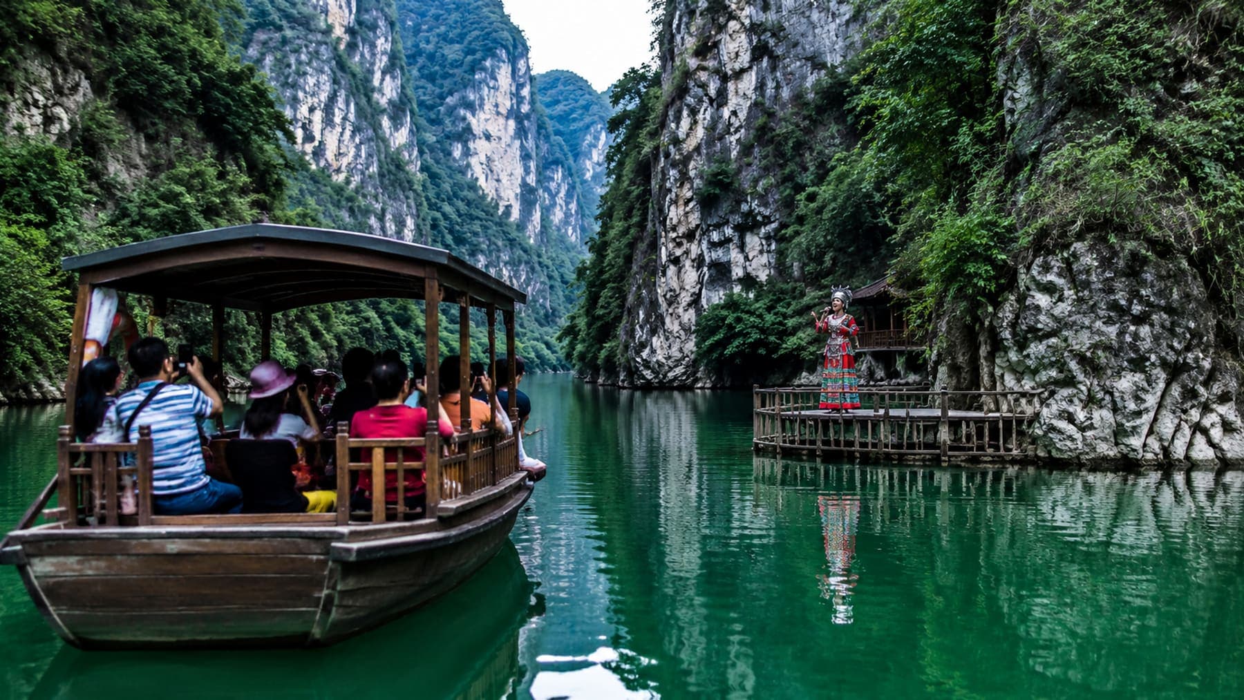 Baofeng Lake wooden boat ride between green cliffs