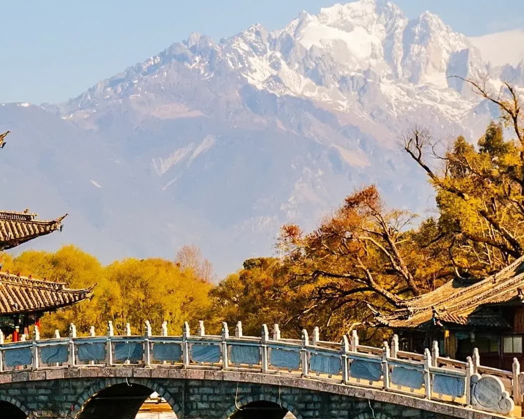 Snow-covered mountains above a winter valley in Yunnan