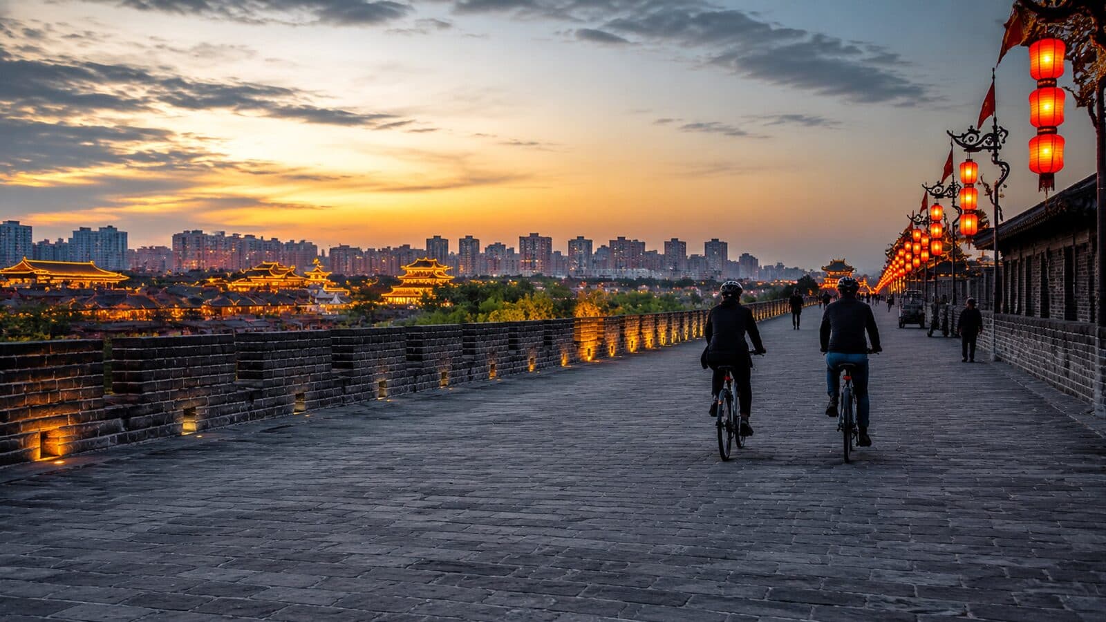 Cyclists on the Xi'an City Wall at sunset