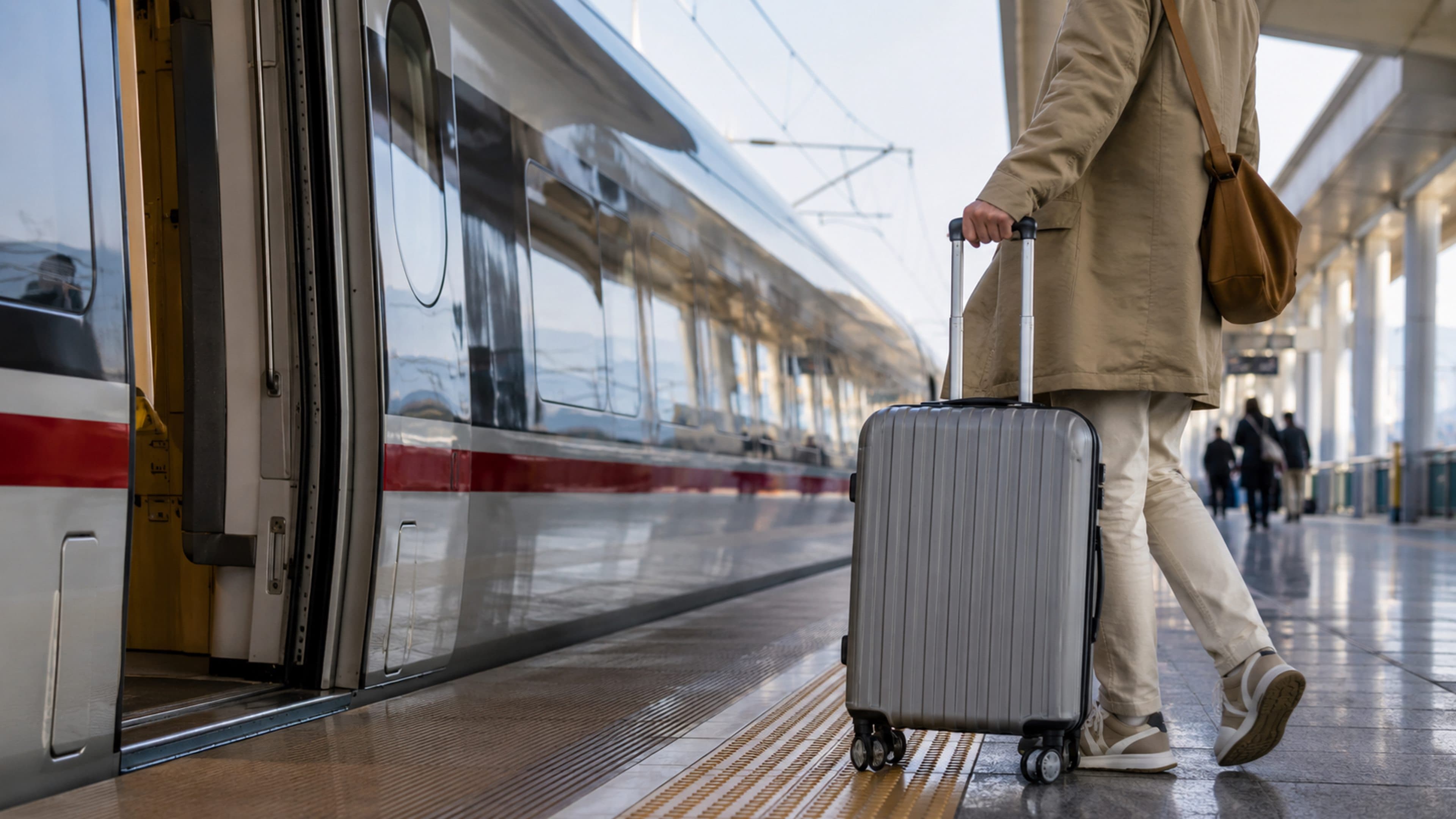 Traveler boarding a China high-speed train with luggage